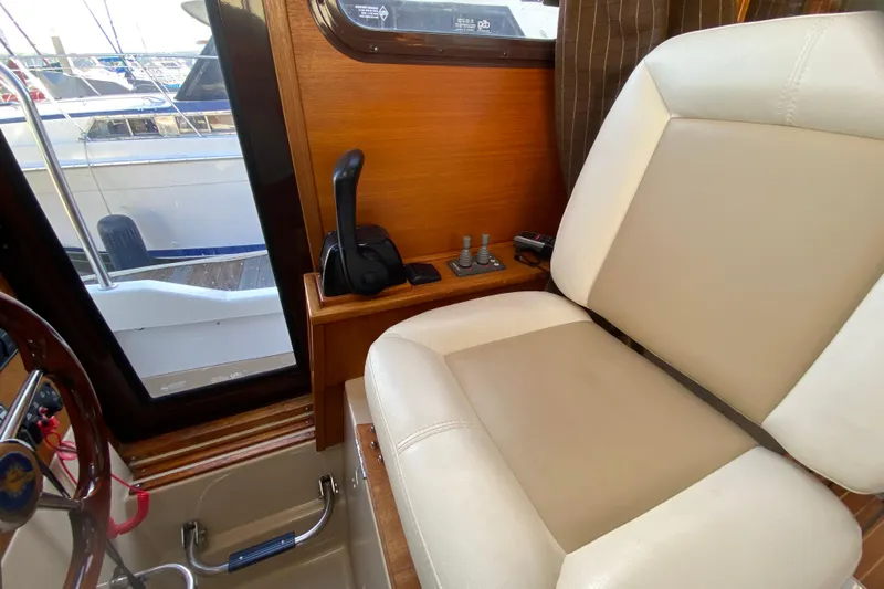 Belle Journee Yacht Photos Pics Interior of 2013 Ranger Tugs R-29 S boat with helm seat and controls.