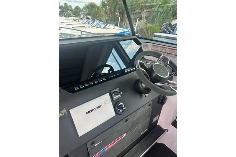 Hell Or High Waters Yacht Photos Pics 2024 Axopar 37XC CROSS CABIN helm with Mercury controls and modern steering wheel.