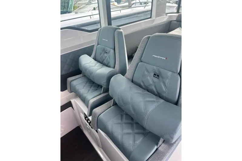 Hell Or High Waters Yacht Photos Pics Luxurious seating in 2024 Axopar 37XC CROSS CABIN with quilted upholstery and armrests.