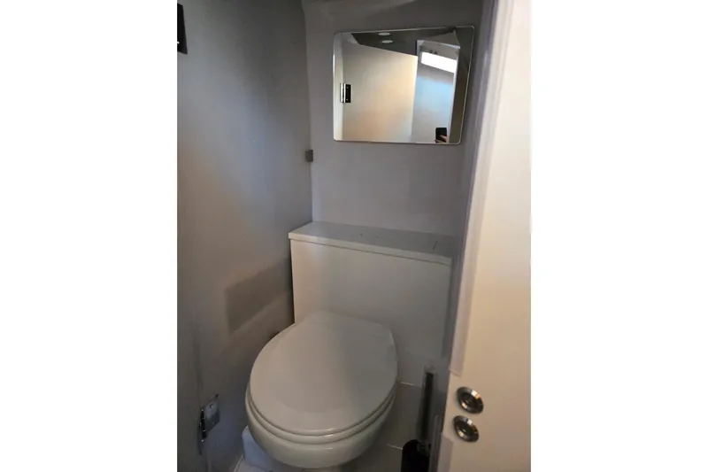 Hell Or High Waters Yacht Photos Pics 2024 Axopar 37XC CROSS CABIN bathroom with toilet and mirror.