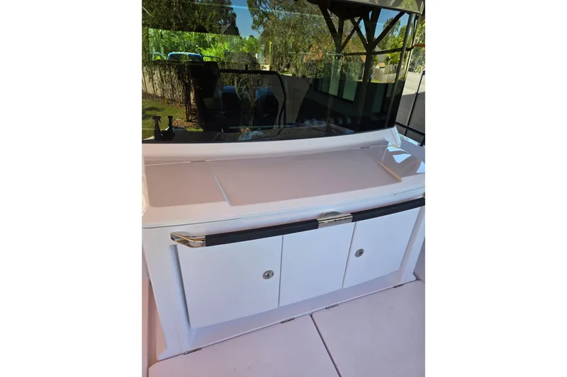 Hell Or High Waters Yacht Photos Pics 2024 Axopar 37XC CROSS CABIN interior with sleek white cabinetry and modern design.