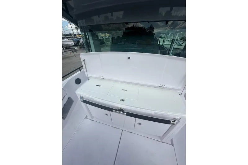 Hell Or High Waters Yacht Photos Pics 2024 Axopar 37XC CROSS CABIN interior with storage compartments and sleek design.