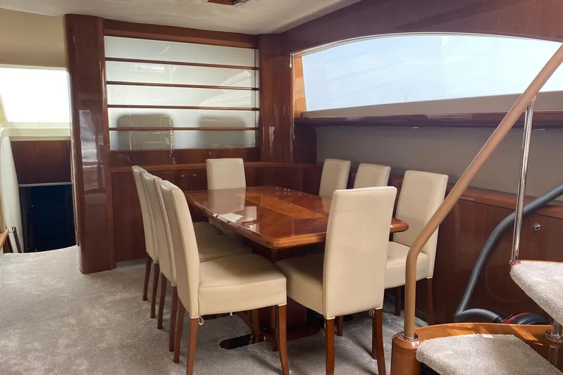 75 Princess 2008 Yacht Photos Pics Luxurious dining area on a 2008 Princess 75 Motor Yacht with elegant wood finishes.