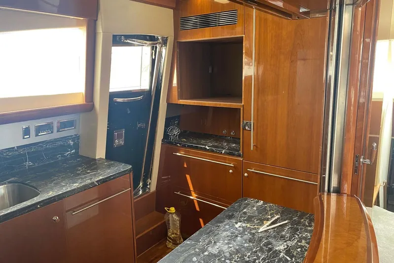 75 Princess 2008 Yacht Photos Pics Luxurious 2008 Princess 75 Motor Yacht interior with elegant wood cabinetry and marble countertops.