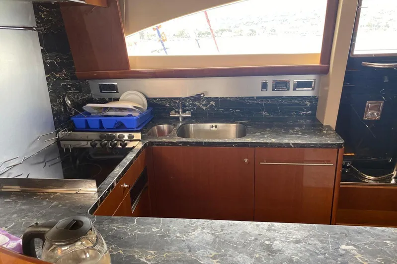 75 Princess 2008 Yacht Photos Pics Luxurious kitchen interior of 2008 Princess 75 Motor Yacht with marble countertops.