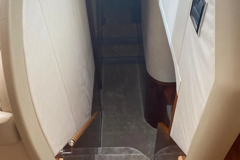 75 Princess 2008 Yacht Photos Pics Stairway inside 2008 Princess 75 Motor Yacht with beige and wood accents.