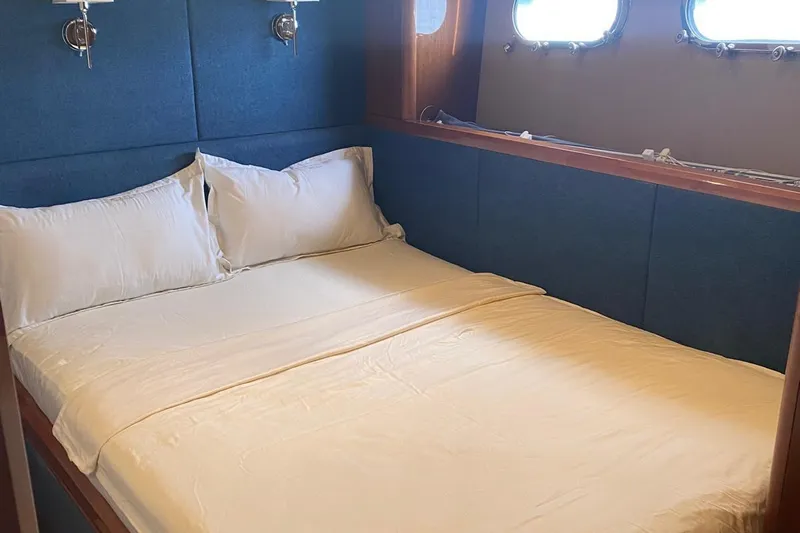 75 Princess 2008 Yacht Photos Pics Luxurious bedroom interior of 2008 Princess 75 Motor Yacht with cozy bedding.