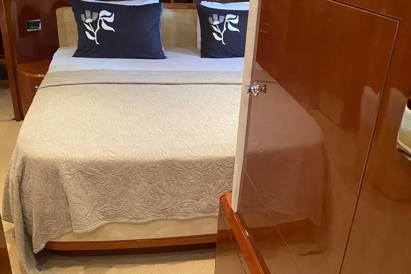 75 Princess 2008 Yacht Photos Pics Luxurious bedroom interior of 2008 Princess 75 Motor Yacht with elegant bedding.