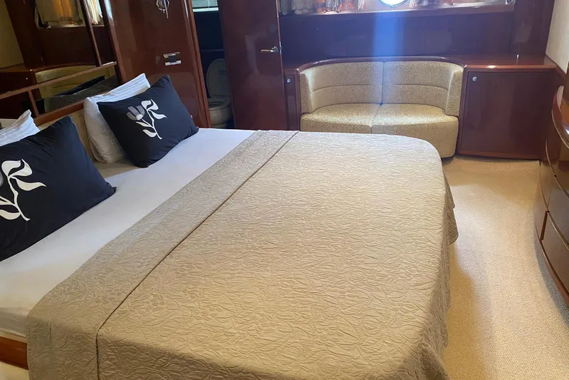 75 Princess 2008 Yacht Photos Pics Luxurious bedroom interior of 2008 Princess 75 Motor Yacht with elegant bedding and seating.