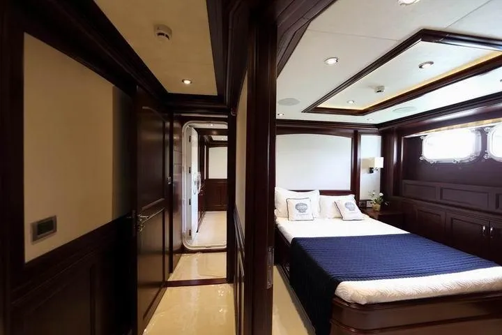 Samsara Yacht Photos Pics Luxurious 2017 Custom Dauntless yacht bedroom with elegant wood paneling and modern lighting.