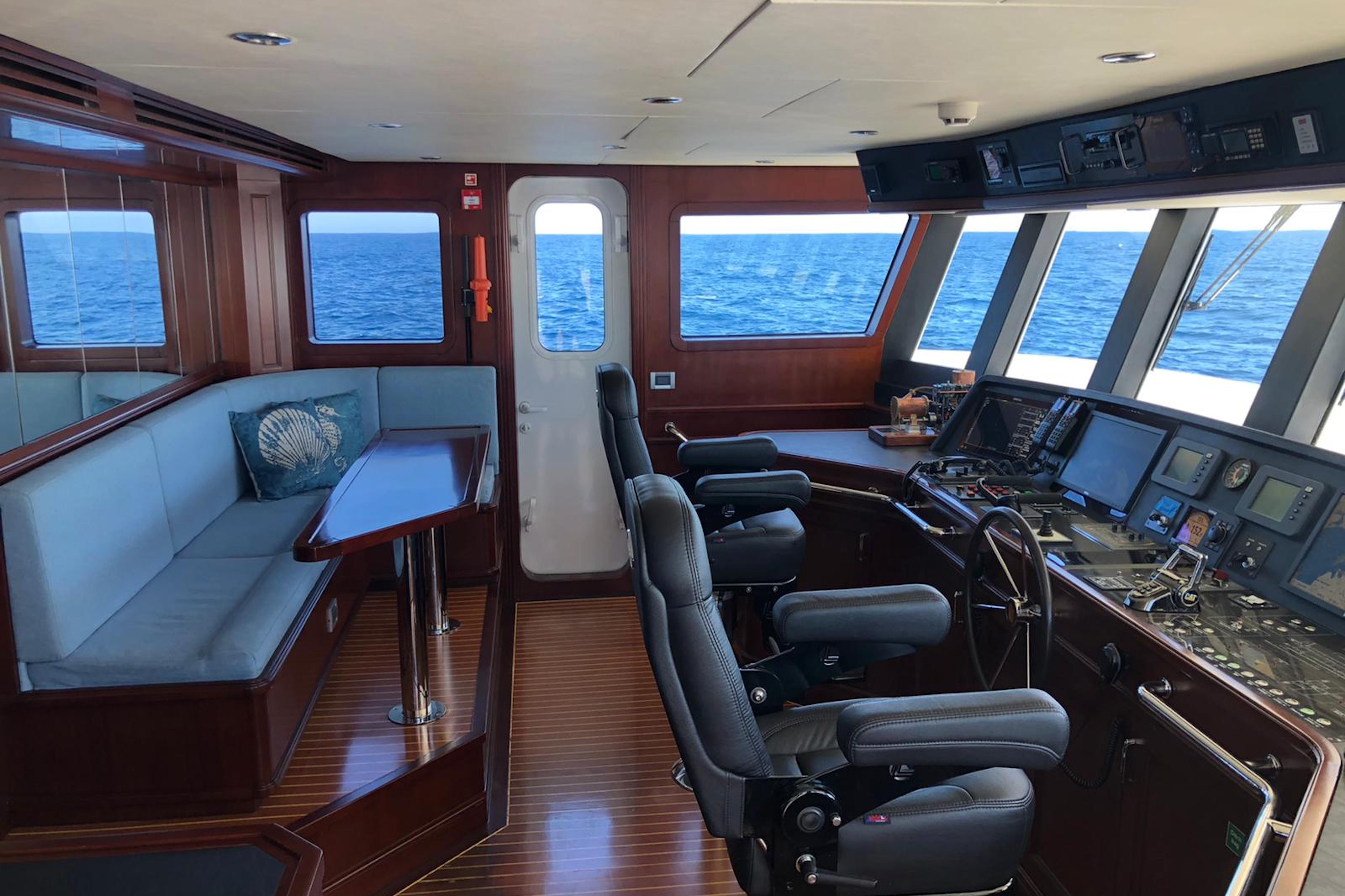 Luxurious 2017 Dauntless Custom yacht interior with navigation controls and ocean view.