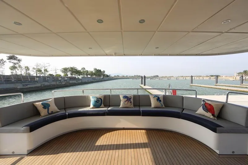 Samsara Yacht Photos Pics Luxurious 2017 Dauntless Custom yacht deck with curved seating and decorative pillows.