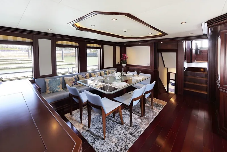 Samsara Yacht Photos Pics Luxurious dining area on 2017 Dauntless Custom yacht with elegant wood finishes and modern decor.