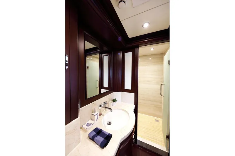 Samsara Yacht Photos Pics Luxurious 2017 Dauntless Custom yacht bathroom with elegant wood accents and modern fixtures.