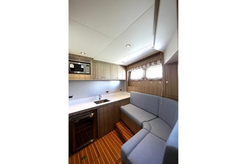 Samsara Yacht Photos Pics 2017 Dauntless Custom yacht interior with modern kitchen and cozy seating area.