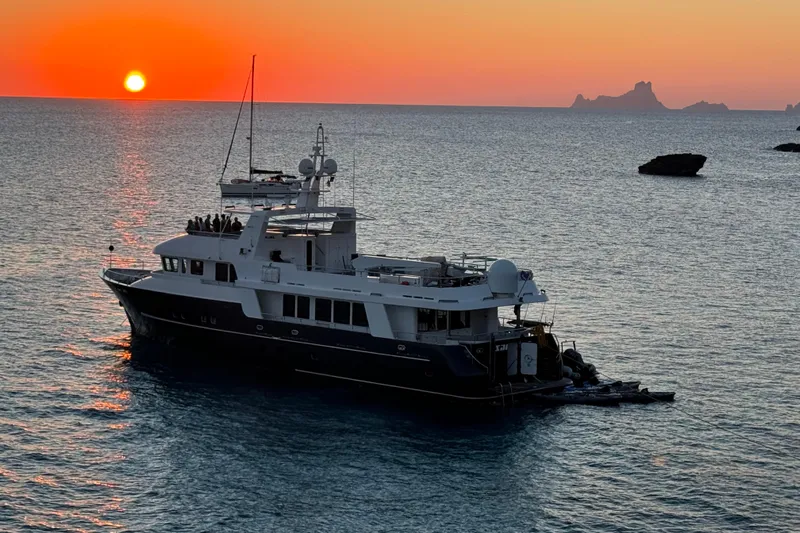 Samsara Yacht Photos Pics Luxury yacht Dauntless Custom 2017 at sunset on tranquil ocean waters.