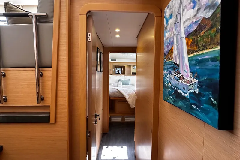 Flotation Therapy Yacht Photos Pics Interior of 2019 Lagoon 450F yacht with cozy bedroom and nautical artwork.