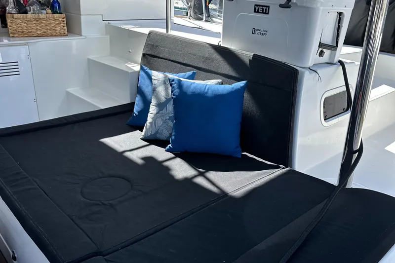 Flotation Therapy Yacht Photos Pics Luxurious seating area on a 2019 Lagoon 450F catamaran with blue cushions.