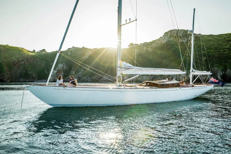 Lady Gwenhyfar Yacht Photos Pics Sailing yacht Spirit Yachts C63, 2018 model, on serene waters with sunlit backdrop.