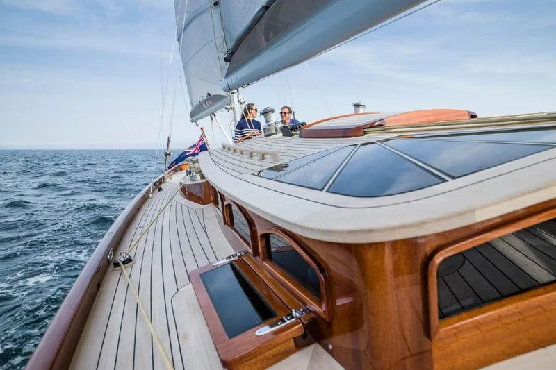 Lady Gwenhyfar Yacht Photos Pics Spirit Yachts C63 sailing on open sea, showcasing elegant wooden deck design, 2018 model.