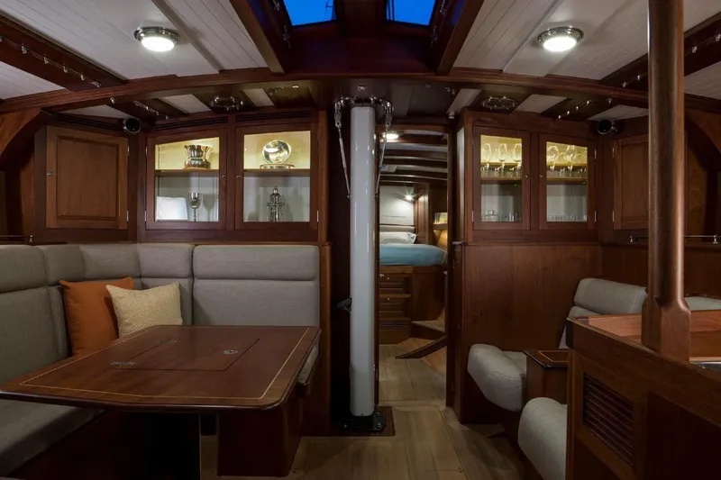 Lady Gwenhyfar Yacht Photos Pics Luxurious interior of 2018 Spirit Yachts C63 with elegant wood finish and cozy seating.