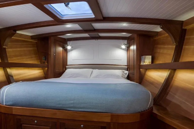Lady Gwenhyfar Yacht Photos Pics Luxurious cabin interior of 2018 Spirit Yachts C63 with wooden finish and skylight.