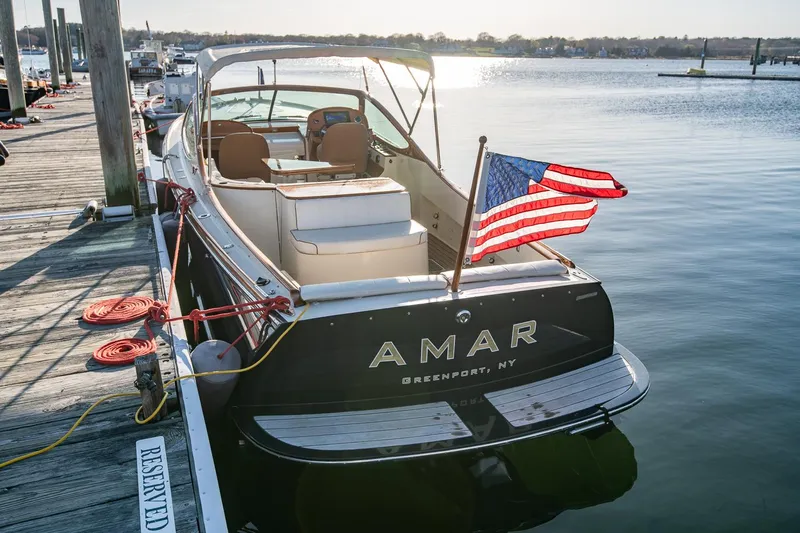 Amar Yacht Photos Pics 2004 Hinckley Talaria 29 Runabout docked with American flag, Greenport, NY.