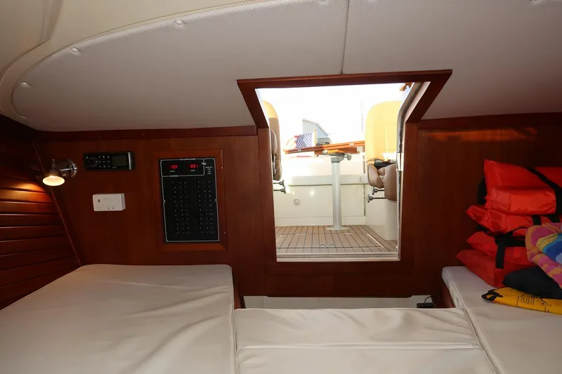 Amar Yacht Photos Pics Interior cabin of 2004 Hinckley Talaria 29 Runabout with seating and life jackets.