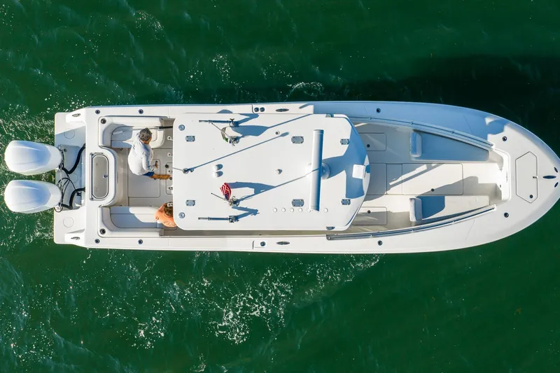 Blue Eyes Yacht Photos Pics Overhead view of 2016 Invincible 33 Open Fisherman boat on green water.