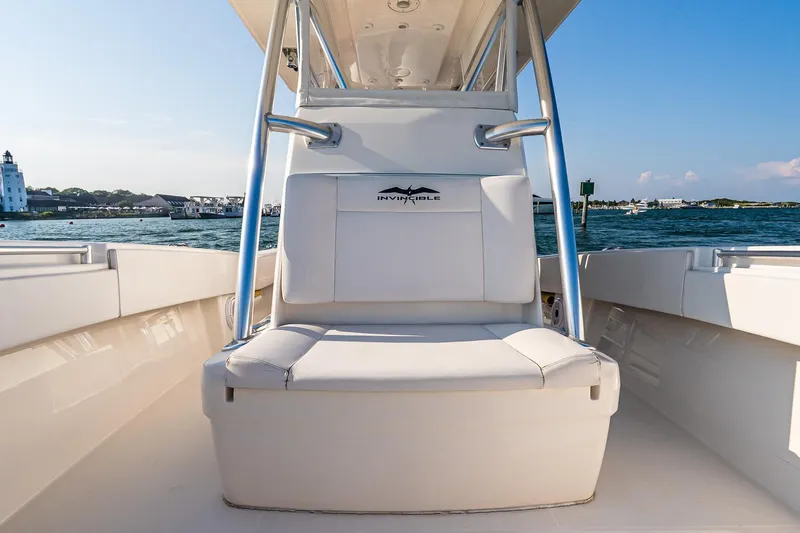 Blue Eyes Yacht Photos Pics 2016 Invincible 33 Open Fisherman boat interior with seating, ocean view, and clear sky.