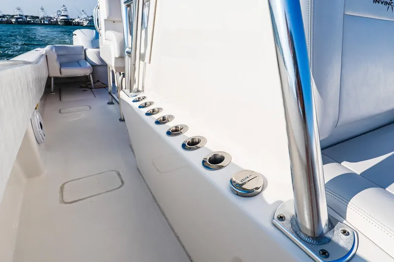 Blue Eyes Yacht Photos Pics 2016 Invincible 33 Open Fisherman boat interior with rod holders and seating.