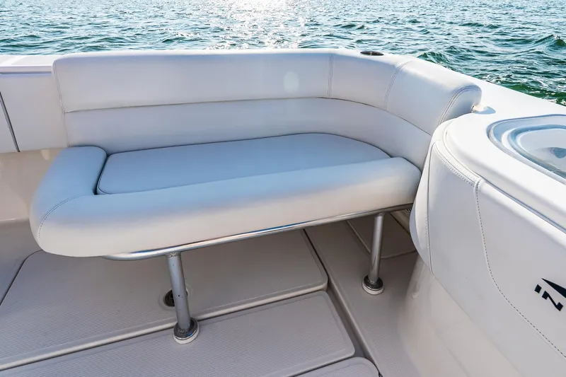 Blue Eyes Yacht Photos Pics 2016 Invincible 33 Open Fisherman boat with white cushioned seating on deck.