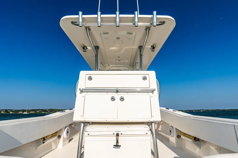 Blue Eyes Yacht Photos Pics 2016 Invincible 33 Open Fisherman boat, center console view, clear blue sky background.