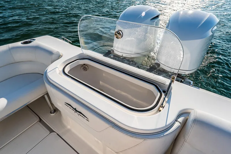 Blue Eyes Yacht Photos Pics 2016 Invincible 33 Open Fisherman boat with dual engines and seating, on water.