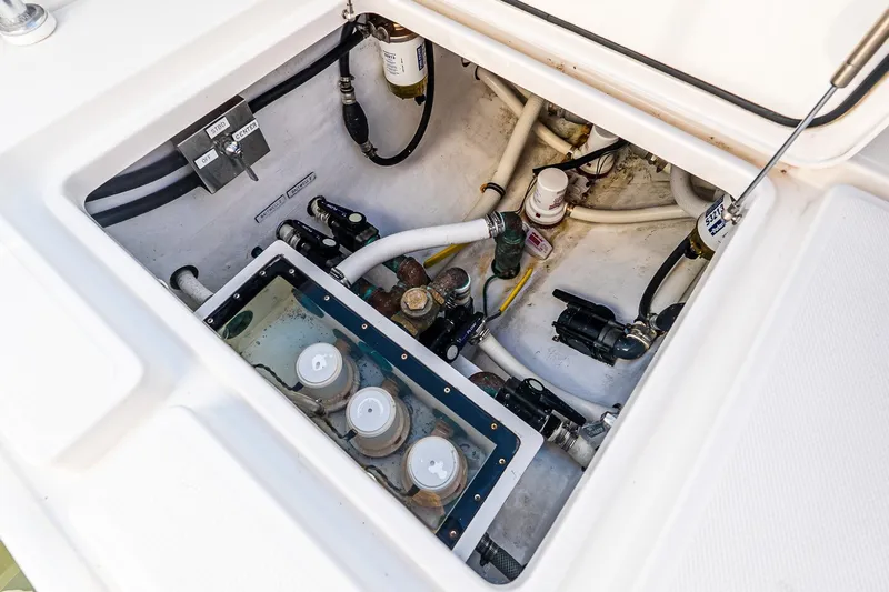 Blue Eyes Yacht Photos Pics Bilge compartment of 2016 Invincible 33 Open Fisherman with visible pumps and hoses.