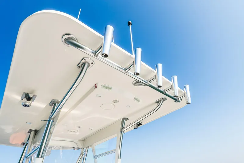 Blue Eyes Yacht Photos Pics 2016 Invincible 33 Open Fisherman boat's T-top against clear blue sky.