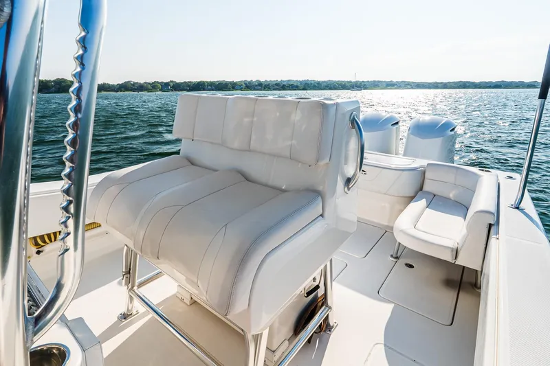 Blue Eyes Yacht Photos Pics 2016 Invincible 33 Open Fisherman boat interior with seating, on a sunny day at sea.