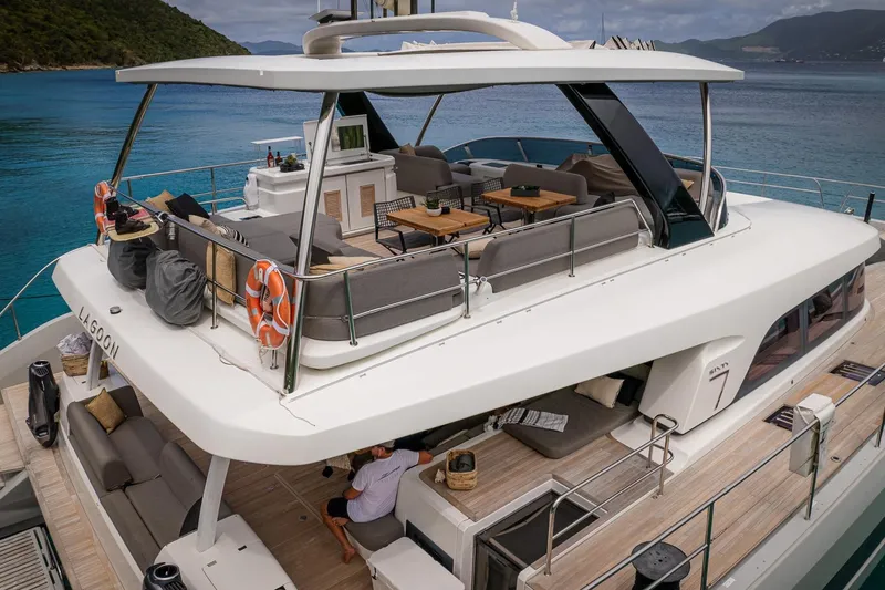 Cest La Vie Yacht Photos Pics Luxurious 2022 Lagoon SIXTY 7 yacht with spacious deck and seating area.