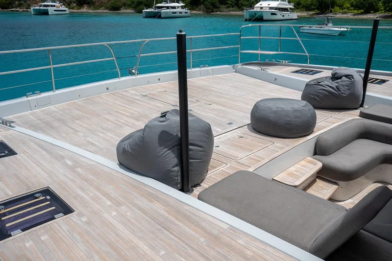 Cest La Vie Yacht Photos Pics Luxurious deck of 2022 Lagoon SIXTY 7 yacht with bean bags and seating.
