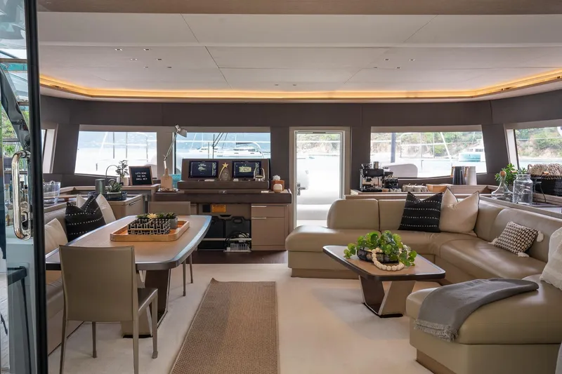 Cest La Vie Yacht Photos Pics Luxurious interior of 2022 Lagoon SIXTY 7 yacht with elegant seating and modern decor.