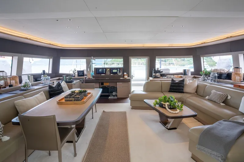 Cest La Vie Yacht Photos Pics Luxurious interior of 2022 Lagoon SIXTY 7 yacht with elegant seating and modern decor.