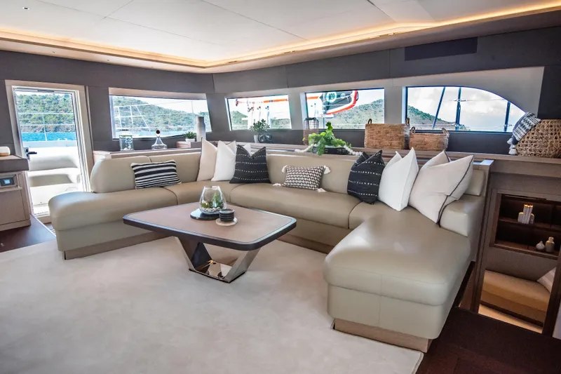 Cest La Vie Yacht Photos Pics Luxurious interior of 2022 Lagoon SIXTY 7 yacht with elegant seating and decor.