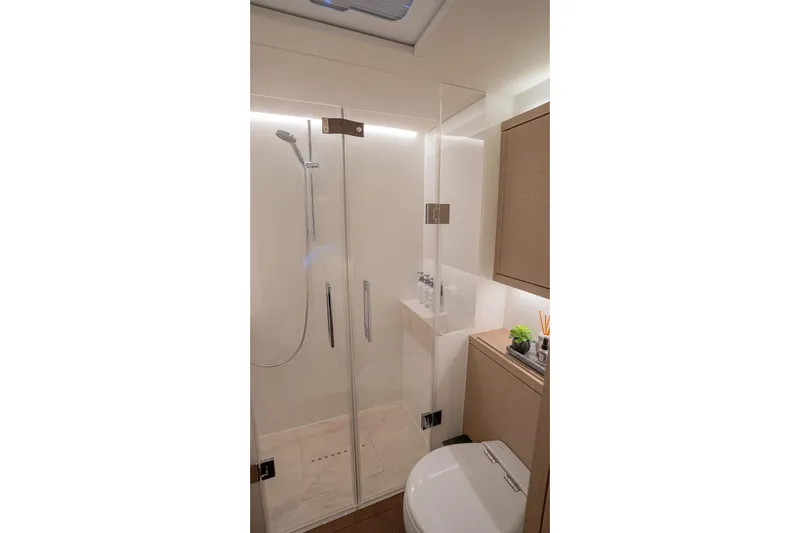 Cest La Vie Yacht Photos Pics Luxurious bathroom in 2022 Lagoon SIXTY 7 yacht with modern shower and elegant fixtures.