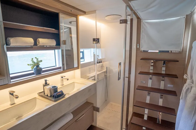 Cest La Vie Yacht Photos Pics Luxurious bathroom in 2022 Lagoon SIXTY 7 yacht with modern fixtures and elegant design.