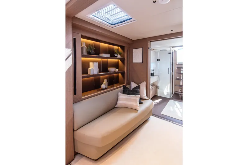 Cest La Vie Yacht Photos Pics Luxurious interior of 2022 Lagoon SIXTY 7 yacht with elegant seating and modern decor.