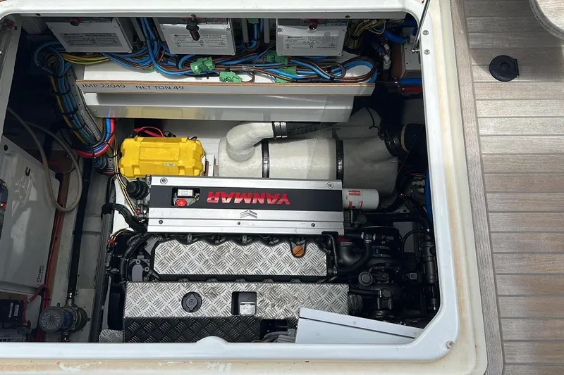 Cest La Vie Yacht Photos Pics Engine compartment of 2022 Lagoon SIXTY 7 yacht, featuring Yanmar engine and electrical components.