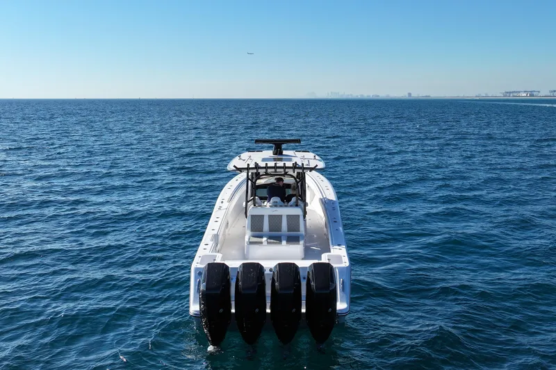  Yacht Photos Pics 2026 Blackwater 41 Sportfish boat on open ocean, rear view with multiple engines.