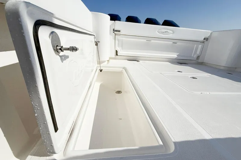  Yacht Photos Pics 2026 Blackwater 41 Sportfish boat deck with open storage compartments.