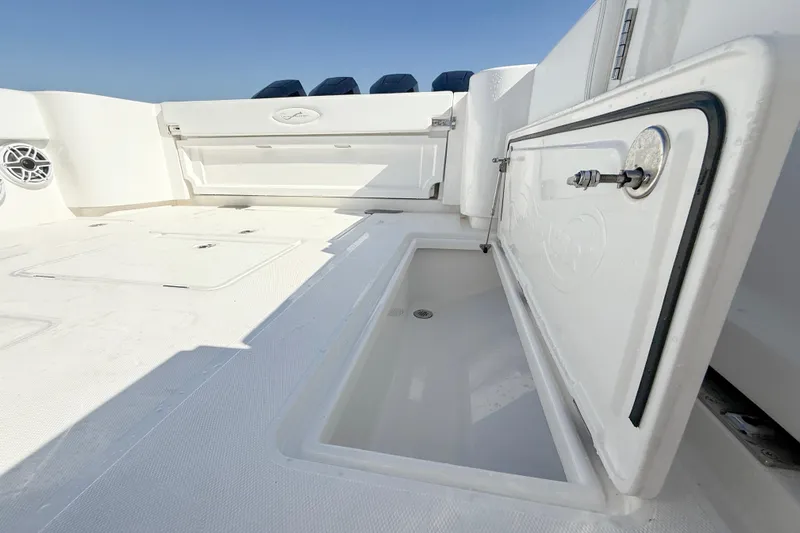  Yacht Photos Pics 2026 Blackwater 41 Sportfish boat deck with open storage compartment.