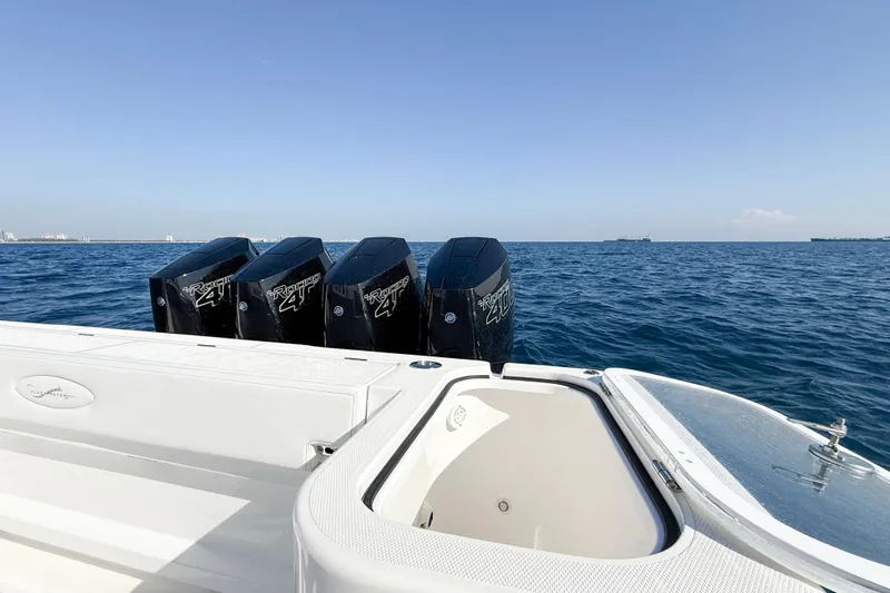  Yacht Photos Pics 2026 Blackwater 41 Sportfish boat with four powerful outboard engines on open sea.